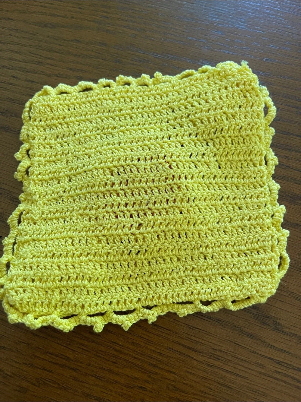Hand Crafted Yellow Crochet Dishcloth with Pink Flower and Green Accents